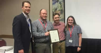 Member of Wildlife and Fisheries Society receiving an award