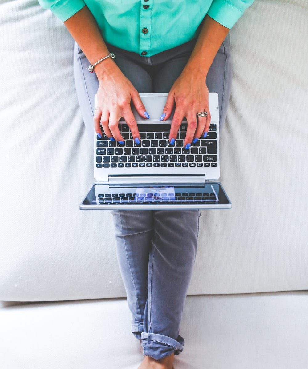 person sitting and working on laptop